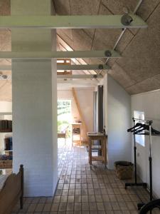 a room with a tile floor and a ceiling at Heltoften Bed & Breakfast in Nykøbing Mors
