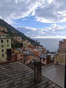 a view of the ocean from a city at San Antonio 50 CA del MOETTO in Riomaggiore