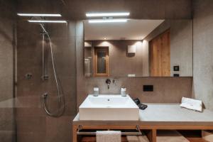 a bathroom with a sink and a shower at Resciesa Hof in Ortisei +31 photos