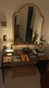 a table in a room with a mirror at Olala House Lanzarote in Haría