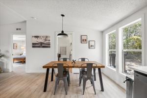 a kitchen and dining room with a wooden table and chairs at Starlight Horizon in Canyon Lake
