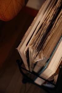 a stack of books sitting on a table at Hotel Garni Alpenhof in Ischgl
