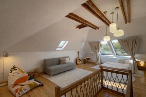 a living room with a couch and a chair at Doftana 609 in Trăisteni
