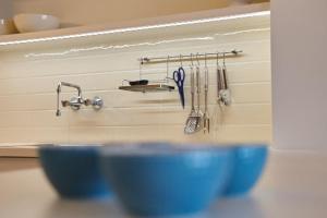 two blue bowls sitting on a table with utensils at Lecomte - The Shoreline Collection 6 in Ostend