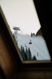 a view of a ski lift from a window at Hotel Garni Alpenhof in Ischgl
