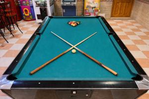 a pool table with cue balls on top of it at Ballestar Hotel Bar & Grill in Barajas de Melo