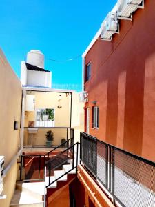a balcony of a building with a railing at Alojamiento - Apart Hotel Libres - Hospedaje in Paso de los Libres