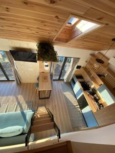 an overhead view of the living room and kitchen of a house at Royal Hill-Prince Chalet Bran- Mountain View and Hot Tub in Sohodol +26 photos