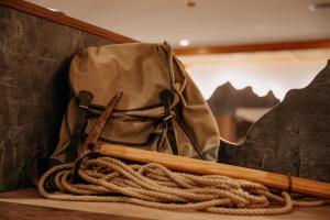 a bag and a baseball bat and a rope at Hotel Garni Alpenhof in Ischgl +106 photos