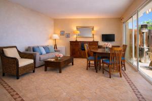 a living room with a couch and a table at Beachfront Villa Cannes I Garden - Terrace & Sea View -Prime Location- Free Parking in Cannes +34 photos