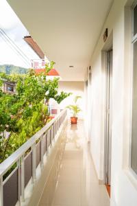 an empty corridor of a building with plants at Valle Hermoso in San Ramón