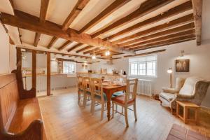 a kitchen and dining room with a table and chairs at 4 Bed in Westleton oc-holc in Westleton