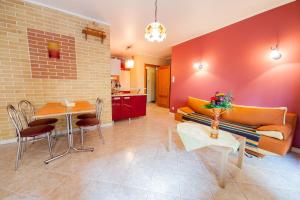 a living room with a couch and a table at Apartament Eva in Wrocław +8 photos