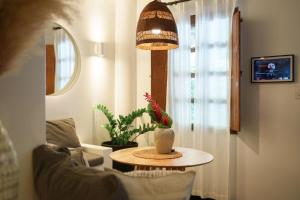 a living room with a table and a potted plant at Vayu Retreat Villas in Coronado