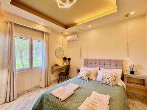 a bedroom with a bed with pillows and a window at Villa Sunlight Sidari with private pool by DadoVillas in Sidari +15 photos