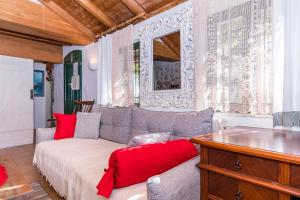 a living room with a couch and a table at House Dobrila in Igrane