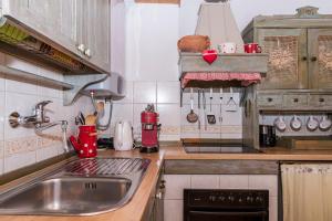 a kitchen with a sink and a counter top at House Dobrila in Igrane