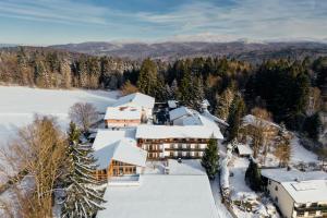 an aerial view of a resort in the snow at Landhotel Tannenhof in Spiegelau