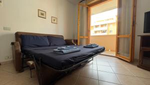 a bed with towels on it in a room at Tre Archi Sea Home in Lido di Fermo