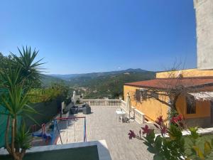 a view of a balcony of a house with mountains in the background at Regina Claudia in Garaguso
