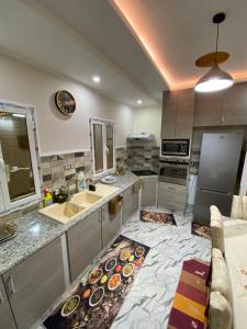a kitchen with a sink and a counter top at Dar Hamma in Tozeur