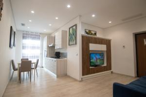 a living room with a kitchen and a dining room at B&B Cannito in Altamura