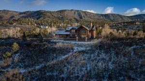 an aerial view of a house in the mountains at 526 Alan Rd - Durango CO. in Durango