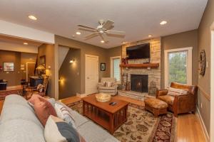 a living room with a couch and a fireplace at Dream On by Railey Vacations in Oakland