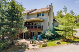 a house with a patio and chairs in the yard at Dream On by Railey Vacations in Oakland