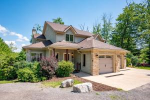 a house with a garage and a driveway at Dream On by Railey Vacations in Oakland