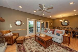 a living room with a couch and a table at Dream On by Railey Vacations in Oakland