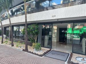 a building with a sign in front of it at Landscape Beira Mar in Fortaleza