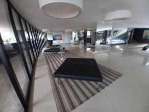 a large lobby with a black bench on the floor at Landscape Beira Mar in Fortaleza +223 photos