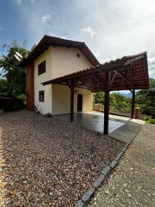 a house with a pavilion in front of it at Casa na Natureza Próx Pomerode e Timbó in Rio dos Cedros