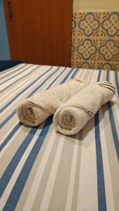 a towel sitting on top of a bed at Boulevard Amazon Suites in Manaus