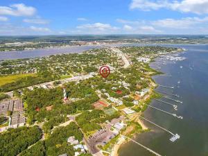 a red balloon flying over a small island in the water at St Augustine Island, King Bed, Beach Living in St. Augustine