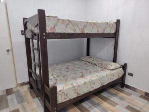 a couple of bunk beds in a room at Ocean Glips II in Punta Negra
