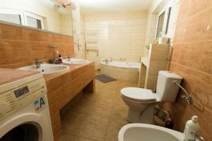 a bathroom with a toilet and a sink and a tub at AzyL25 in Starachowice +15 photos