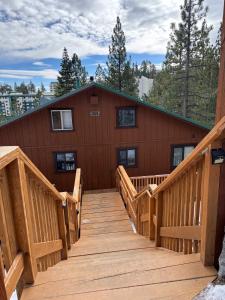 a large deck with stairs leading to a building at Mountain Cabin at Heavenly in Stateline