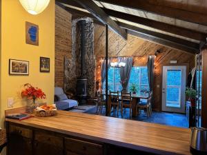 a dining room and living room with a dining table at Mountain Cabin at Heavenly in Stateline