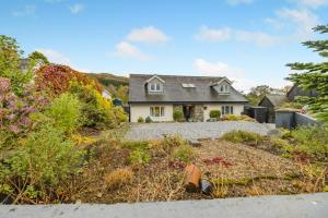 a house with a garden in front of it at 3 Bed in Brithdir oc-c33971 in Llanfachreth