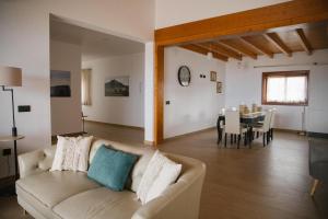 a living room with a couch and a dining room at Blue Petrol Room - Ocean Double Private Suite in Villa Barbuja in Tefía