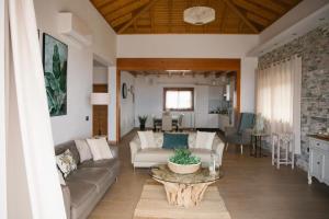 a living room with a couch and a table at Blue Petrol Room - Ocean Double Private Suite in Villa Barbuja in Tefía