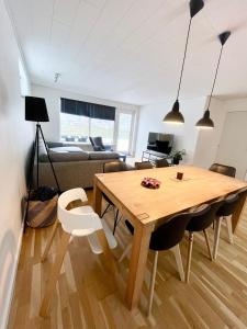 a dining room and living room with a table and chairs at Entire Home in Billund Center in Billund