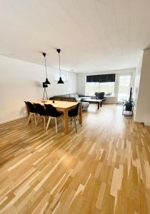 a living room with a table and chairs at Entire Home in Billund Center in Billund