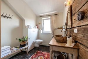 a bathroom with a sink and a toilet at Kaffee&Kissen - Das Boutique Hotel am Rhein in Oestrich-Winkel +44 photos