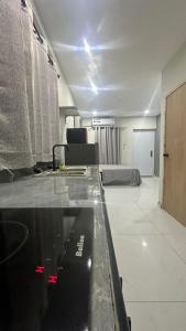 a living room with a room with a couch at Prestige Apartments C - Affordable Studio Near Sambil Shopping Mall with Fast WiFi in Willemstad