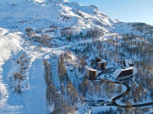 an aerial view of a snow covered mountain with buildings at Sky nest - Matterhorn in Breuil-Cervinia