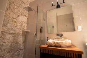 a bathroom with a sink and a shower at Casa Alzate in Morelia +28 photos