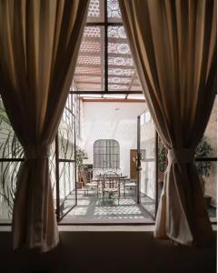 a view of a dining room from a window at Casa Alzate in Morelia